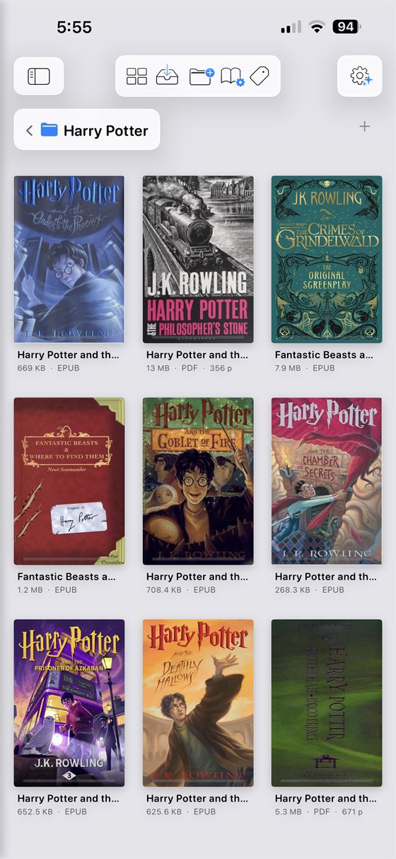 Andrea Reader on iPhone showing a grid of books in the library